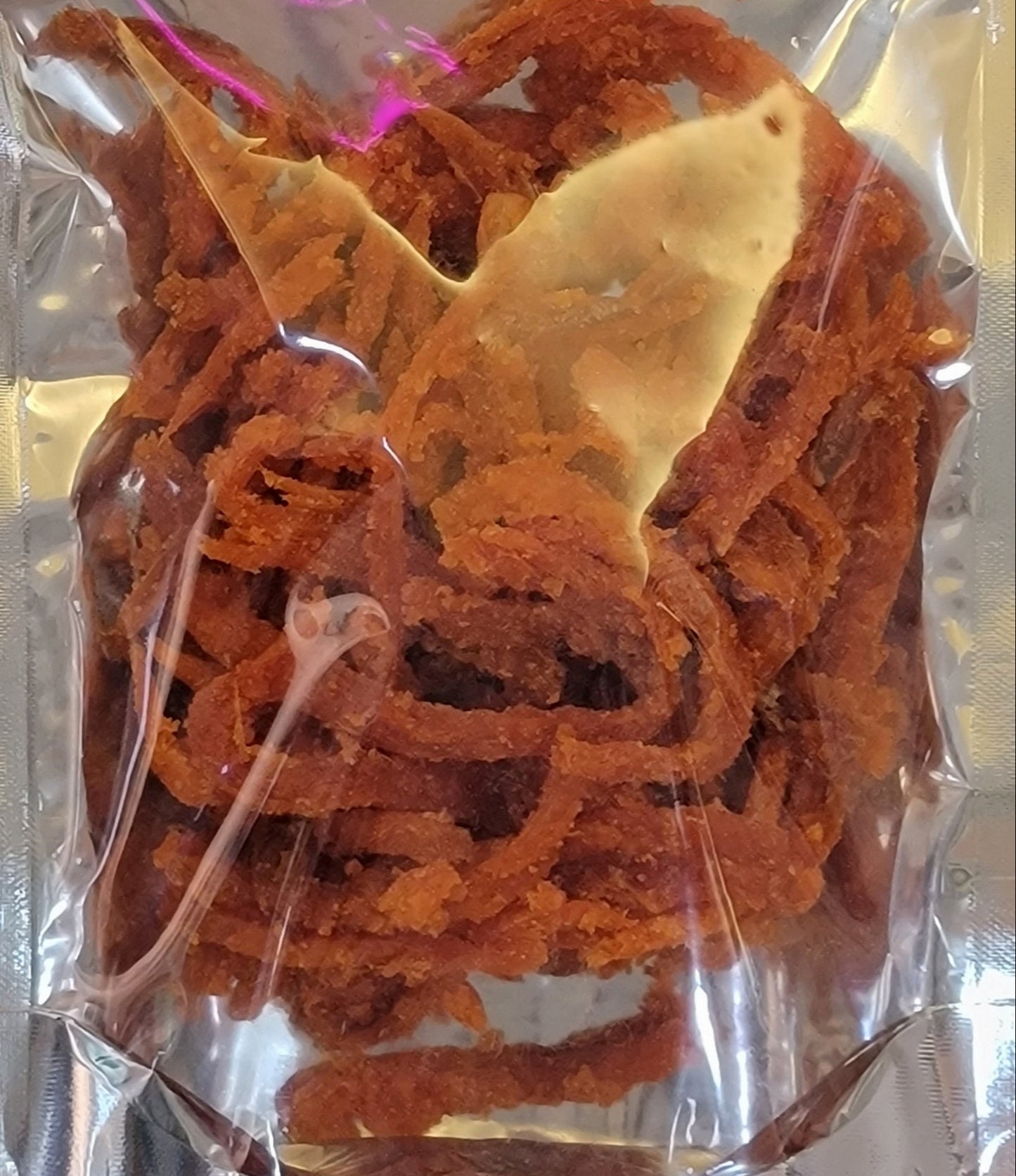 Braise Fish 紅燒魚柳 is a delicious snack that can be enjoyed on its own. It's sweetened and slightly spiced, making it hard to stop once you start eating.